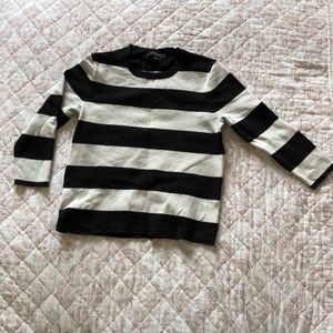 Black and white crew neck sweater.